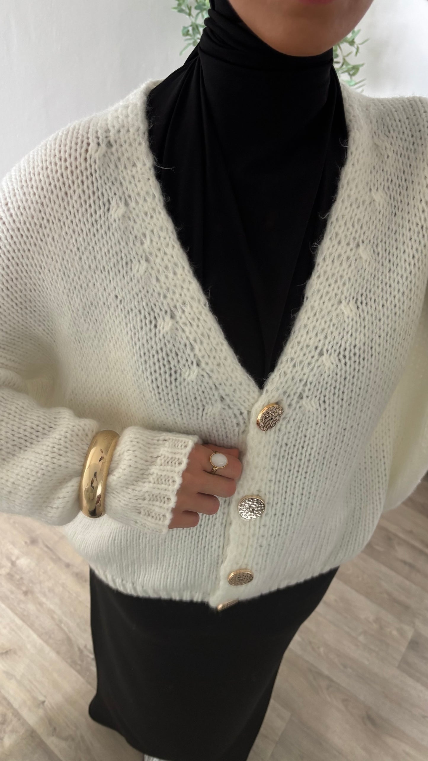 Gilet à bouton dorée